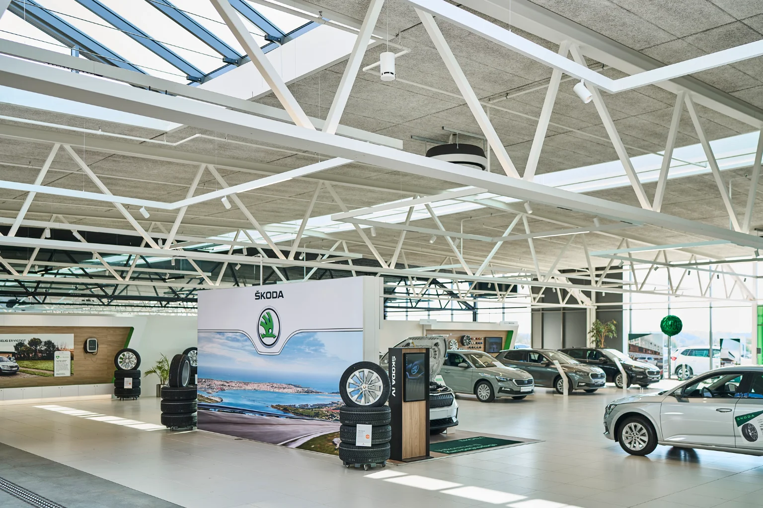White Spottune Omni Cord hanging from the ceiling in a car dealership
